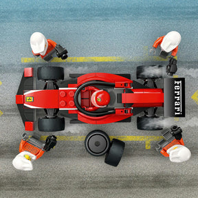 Parada en Boxes de F1® y Equipo de Mecánicos con Coche Ferrari